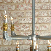 close up industrial ceiling light chandelier with 8 bulbs in galvanised finish 