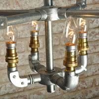 close up of industrial ceiling light chandelier with 8 bulbs in galvanised finish 