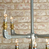 close up industrial ceiling light chandelier with 8 bulbs in galvanised finish 